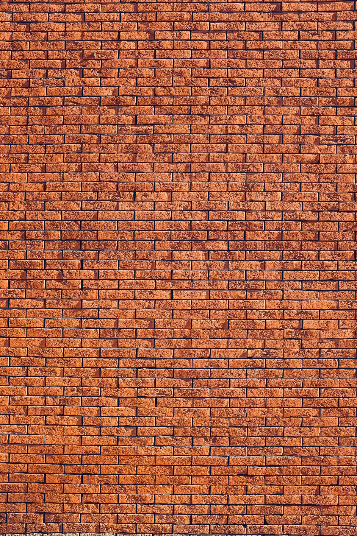 Rode bakstenen muur in halfsteensverband