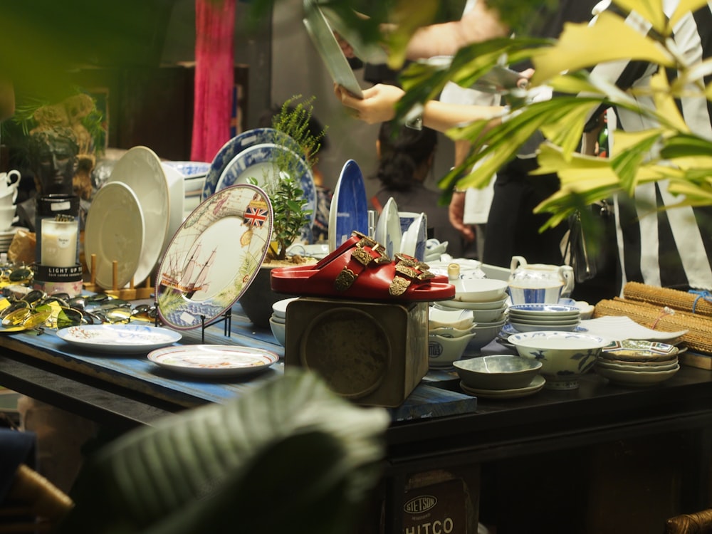 white and blue ceramic dinnerware on table