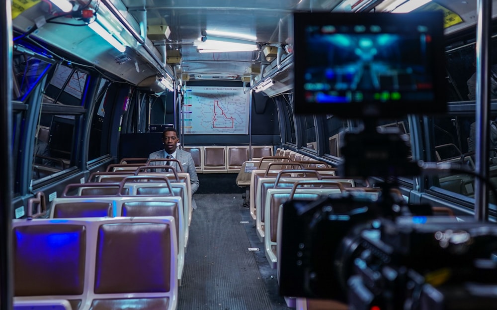 man sitting inside bus