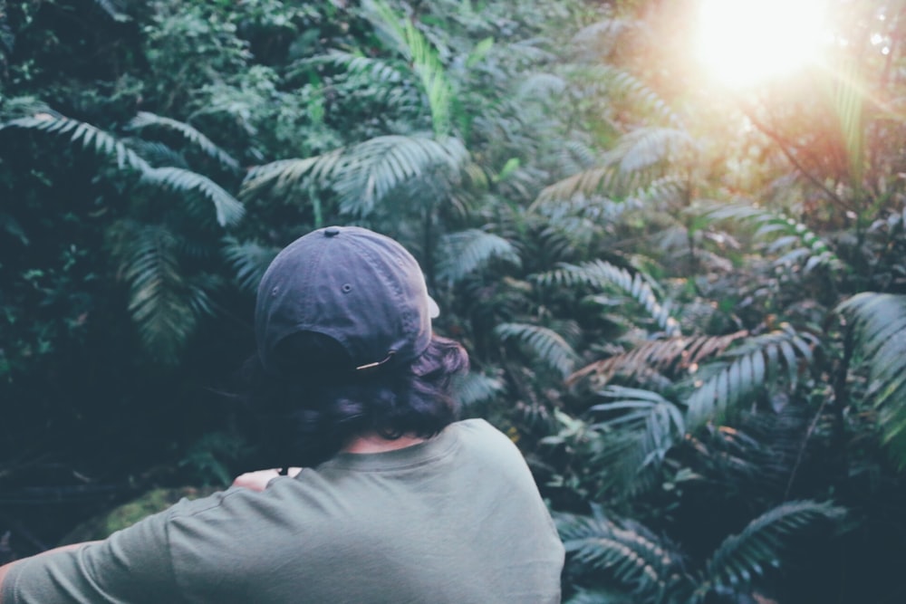 photo of person walking towards into trees