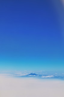 A serene mountain view with a clear blue sky.