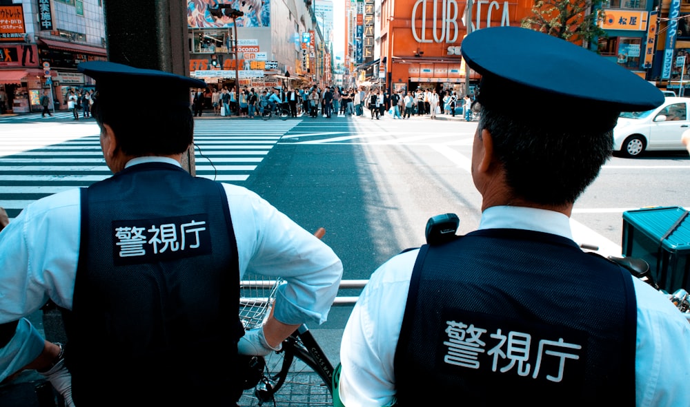 two policemen patrolling on road
