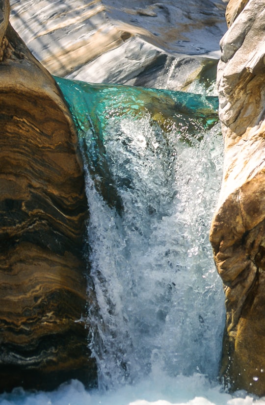 waterfalls during daytime in Brione Switzerland