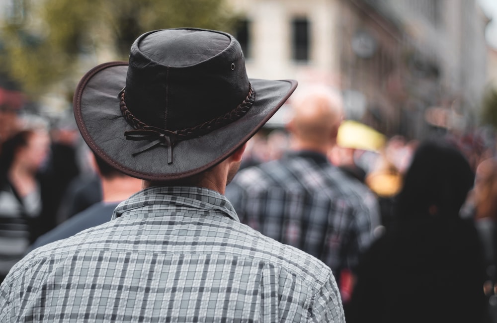 man wearing black cowboy hat