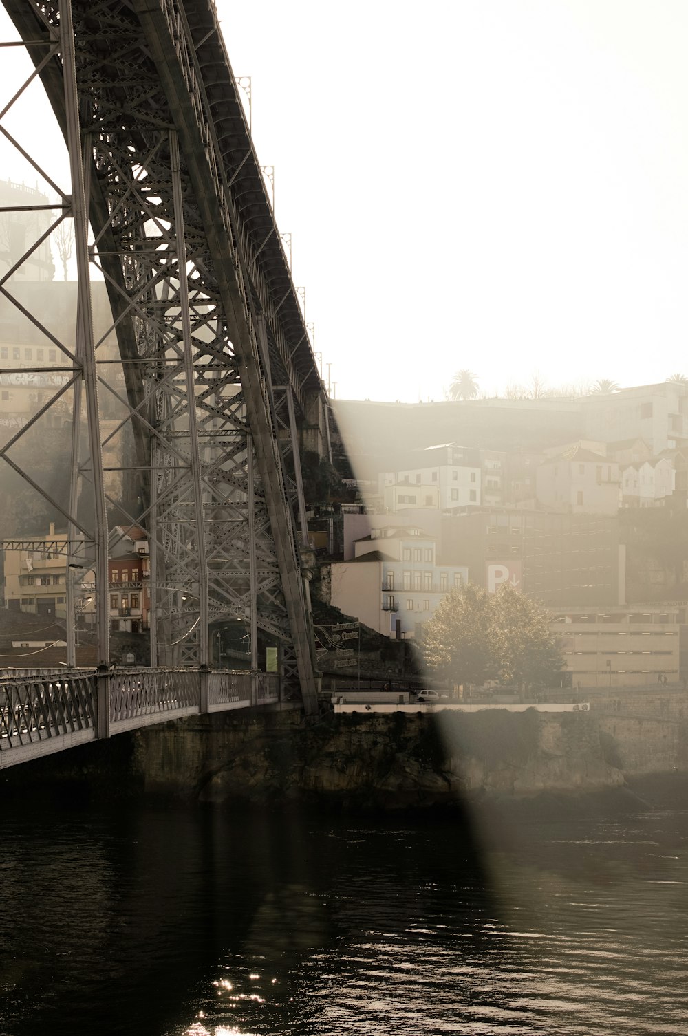 white steel bridge under white sky during daytime