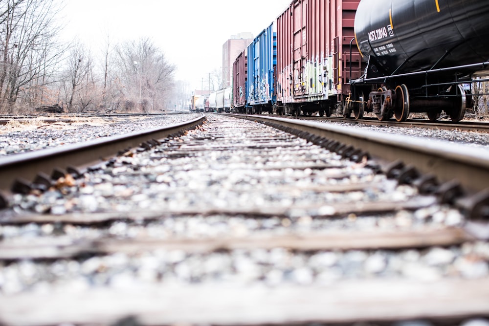 photo of a train rails beside container van