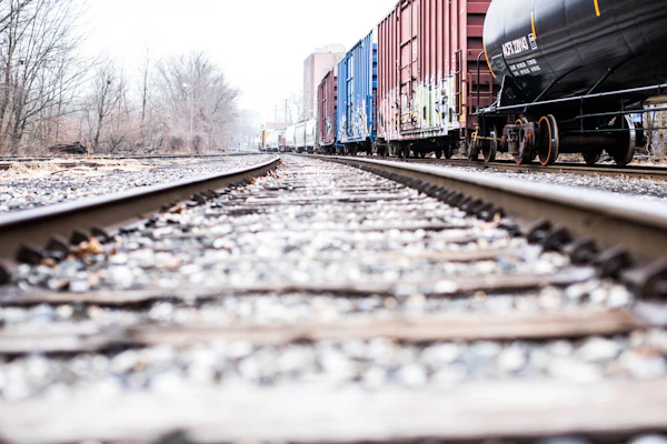 Rail tracks running alongside shipping containers