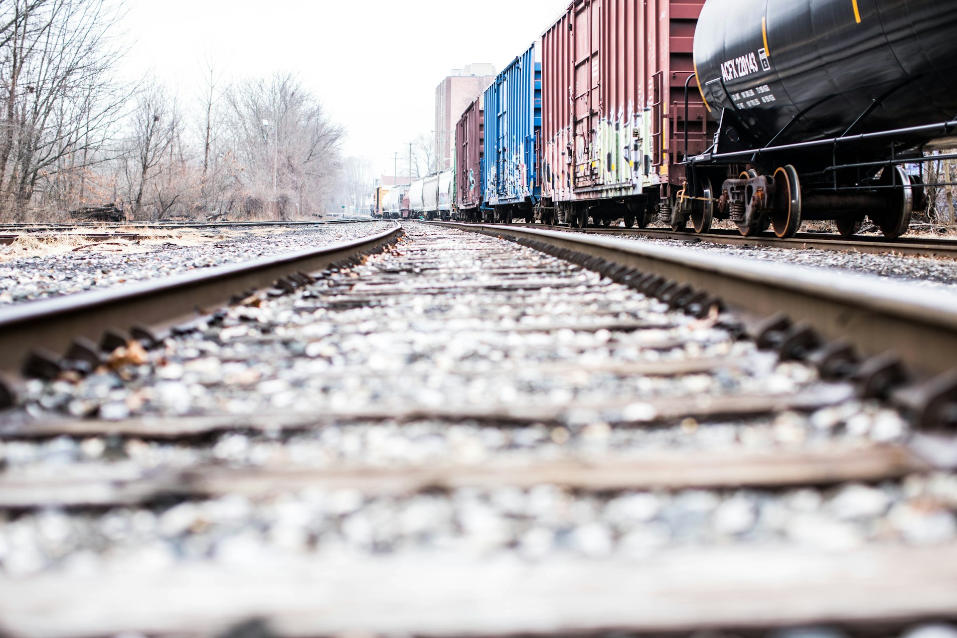 photo of a train rails beside container van