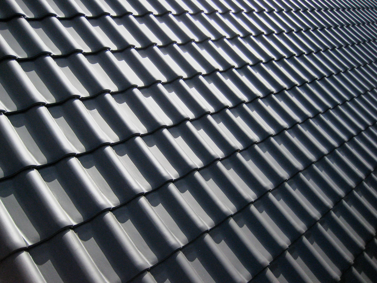 Roofline and shingle edge where gutters protect the home from water damage