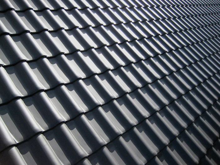 Close-up of storm-affected roof shingles requiring damage restoration