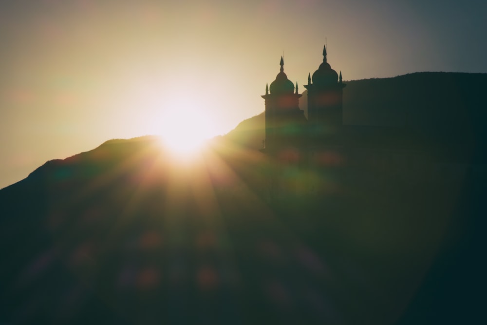 silhouette photo of mosque during golden hour