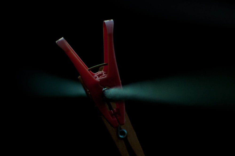 red plastic clothes clip