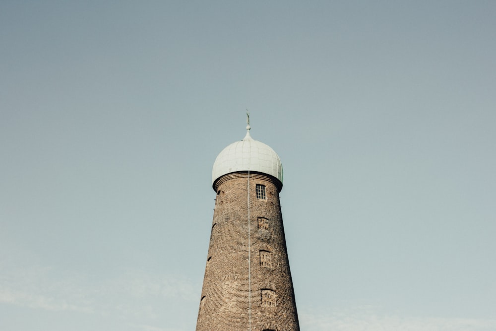 brown and white mosque under blue sky