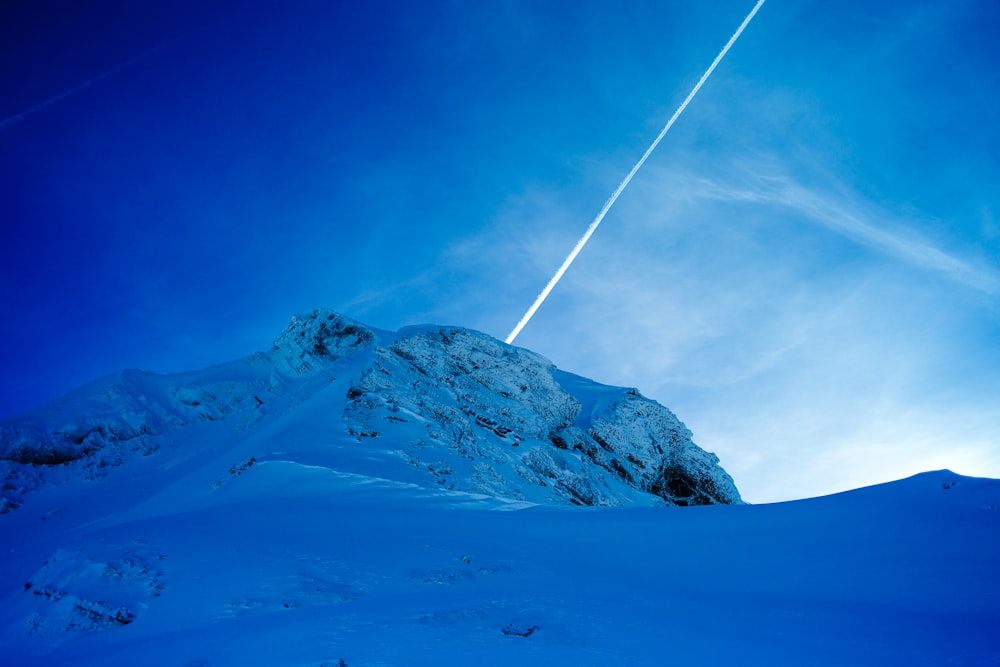 snowy mountain summit during daytime