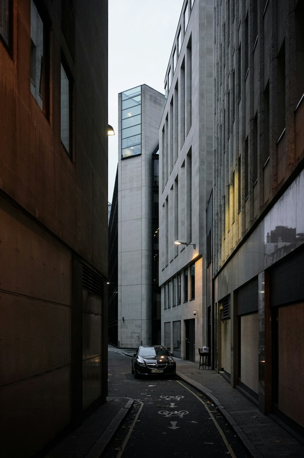 car travelling near buildings during daytime