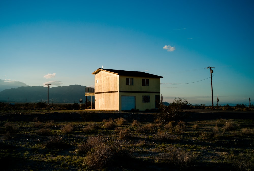 low-angle photography of house beside street