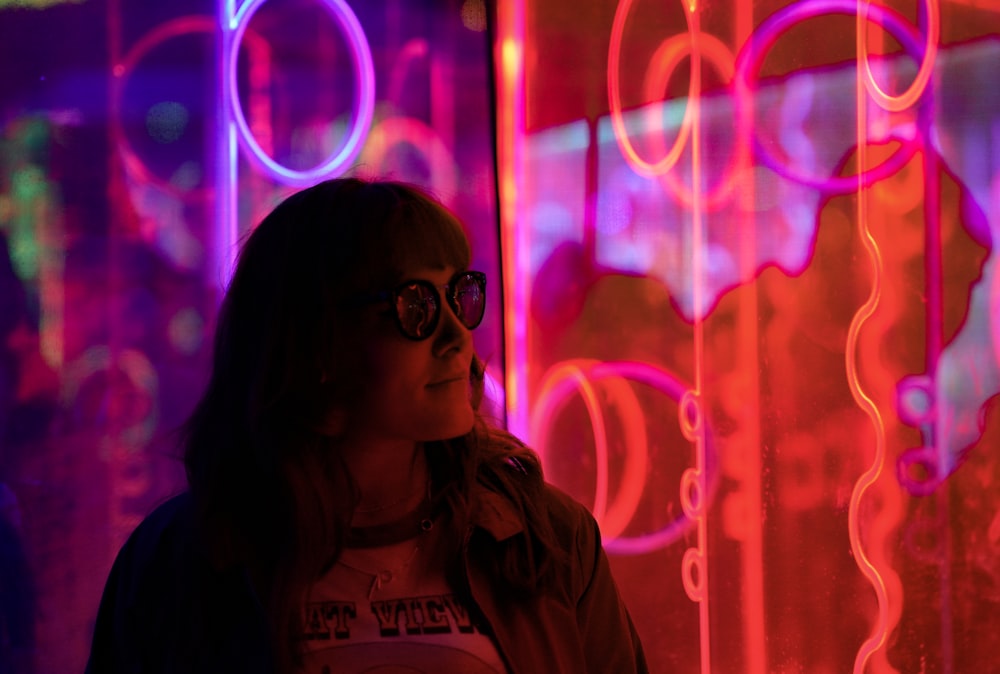 woman standing near glass panel