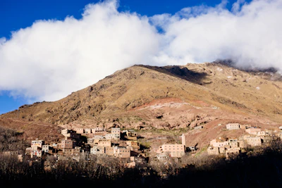 Traditional Berber village nestled in the Atlas Mountains under a clear blue sky.