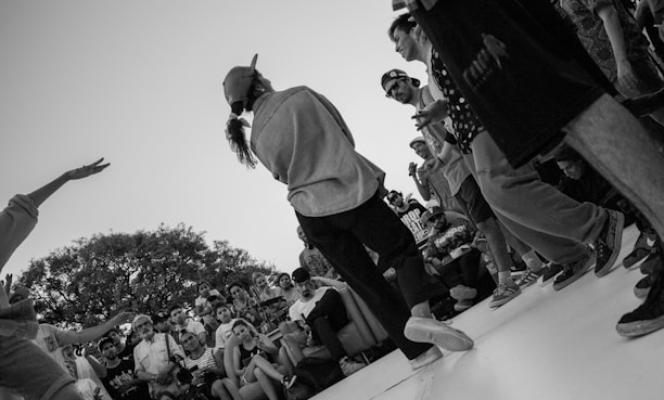 A dynamic shot capturing the ambassador in action, engaging with fans at a lively gathering.