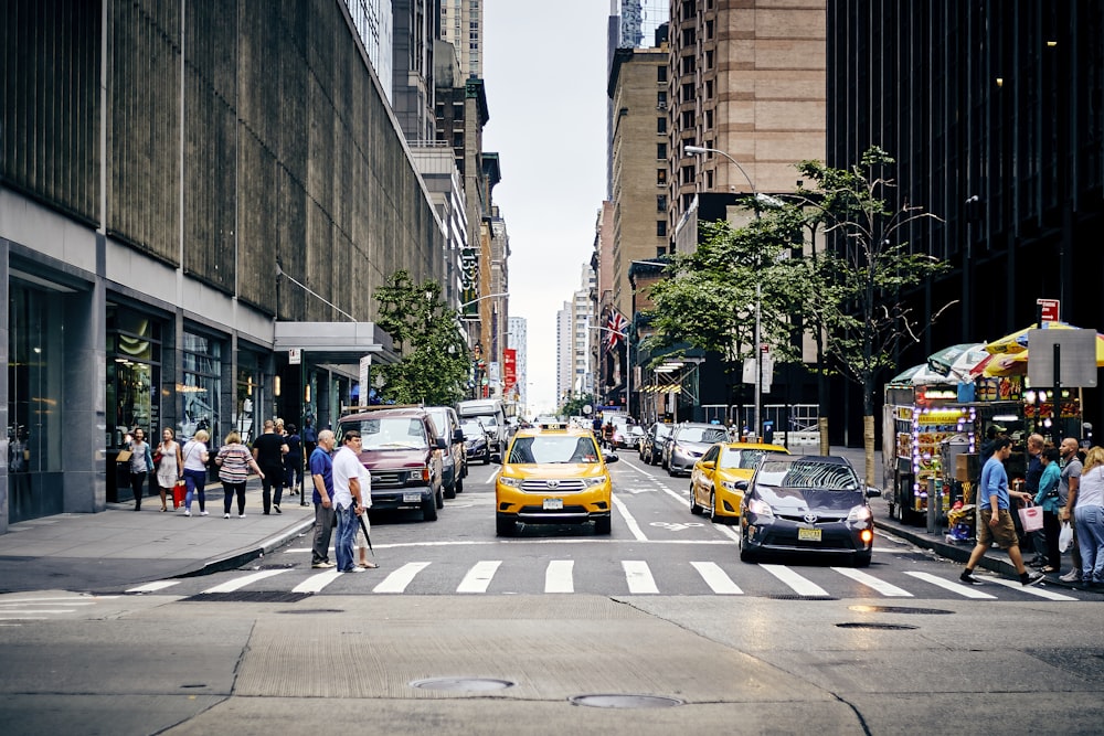 city street with people passing through road