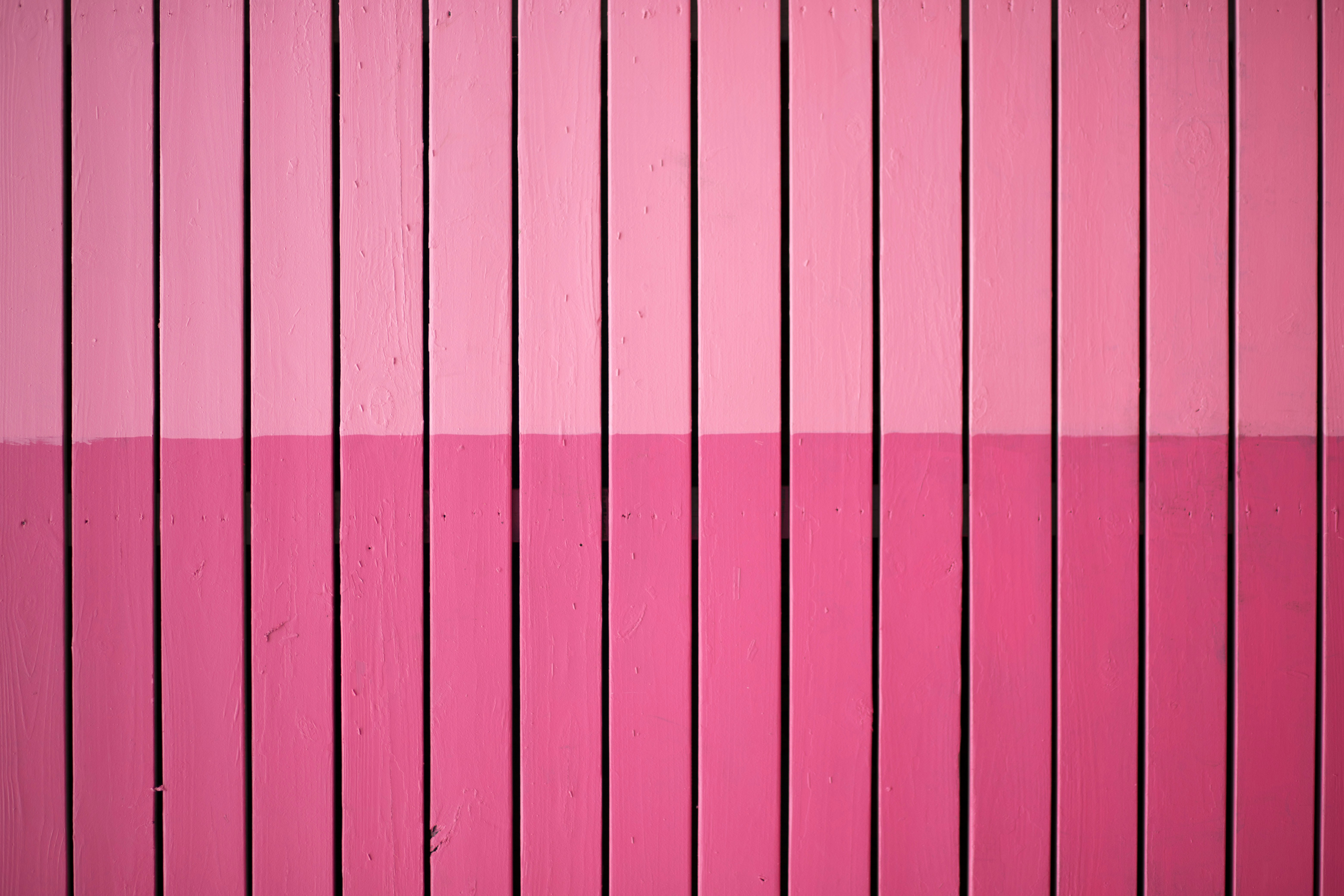 closeup photo of pink paint plank wall