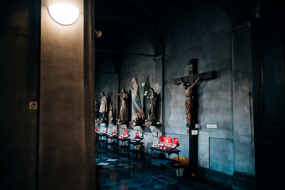 religious statues on gray concrete wall