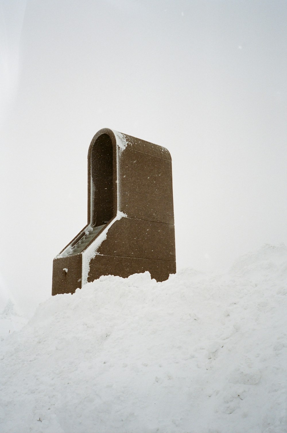 photo of brown case on snow ground