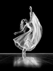 grayscale photography of woman doing ballet