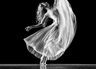 grayscale photography of woman doing ballet