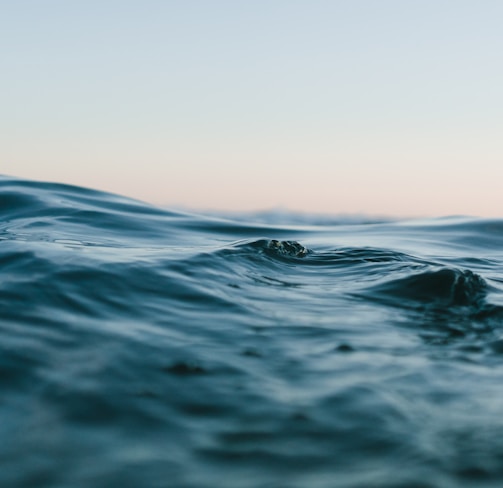 body of water under sky