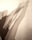 Multiple elongated shadows of a person in a dynamic stretching pose appear on a plain background. The shadows overlap and create a layered effect, suggesting movement and depth.