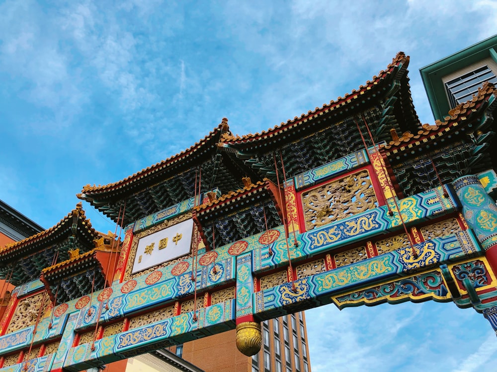 photo of teal and red temple gate