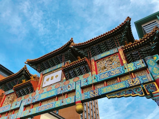 photo of teal and red temple gate in Chinatown United States