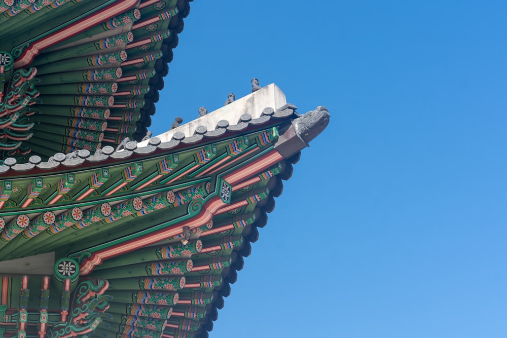 the roof of a building with a blue sky in the background