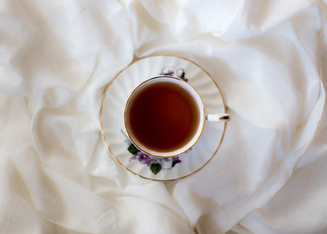 aerial photography of ceramic cup and saucer