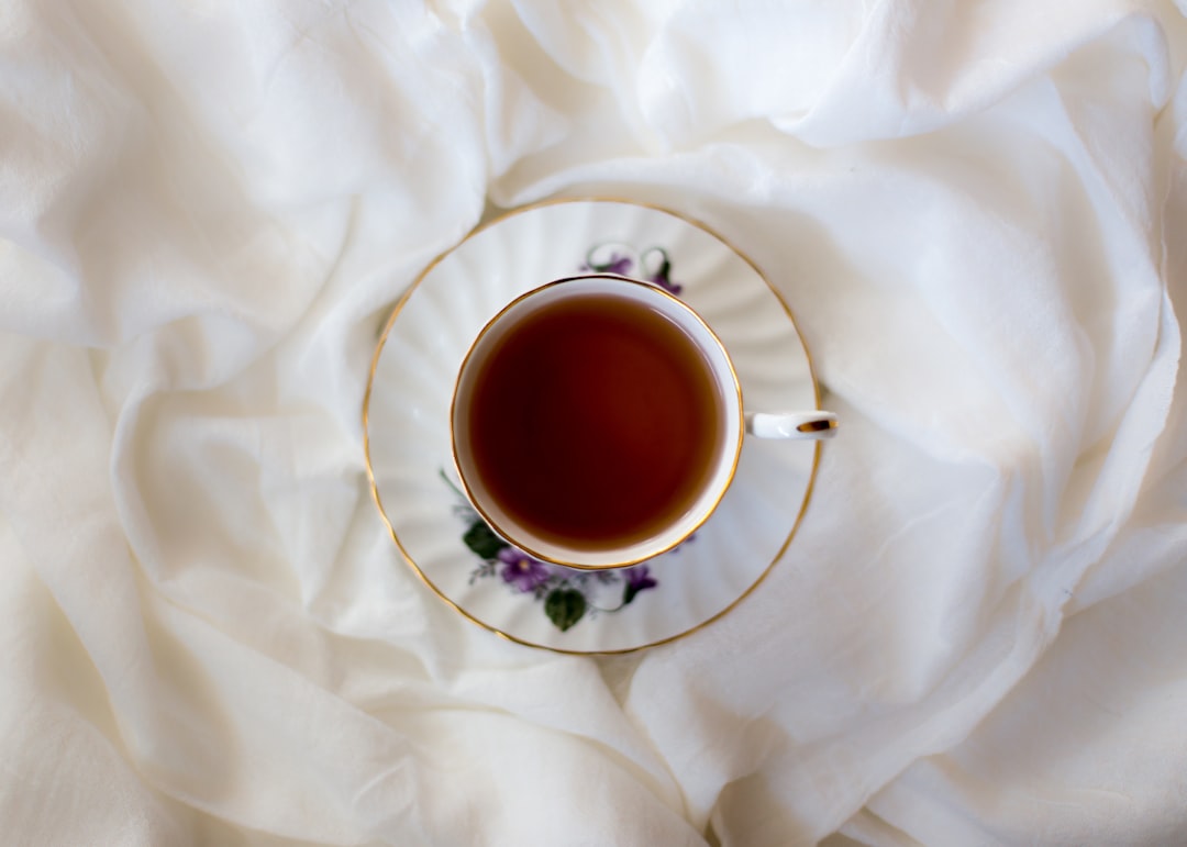 aerial photography of ceramic cup and saucer