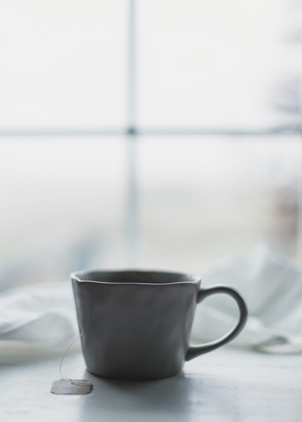 white ceramic teacup