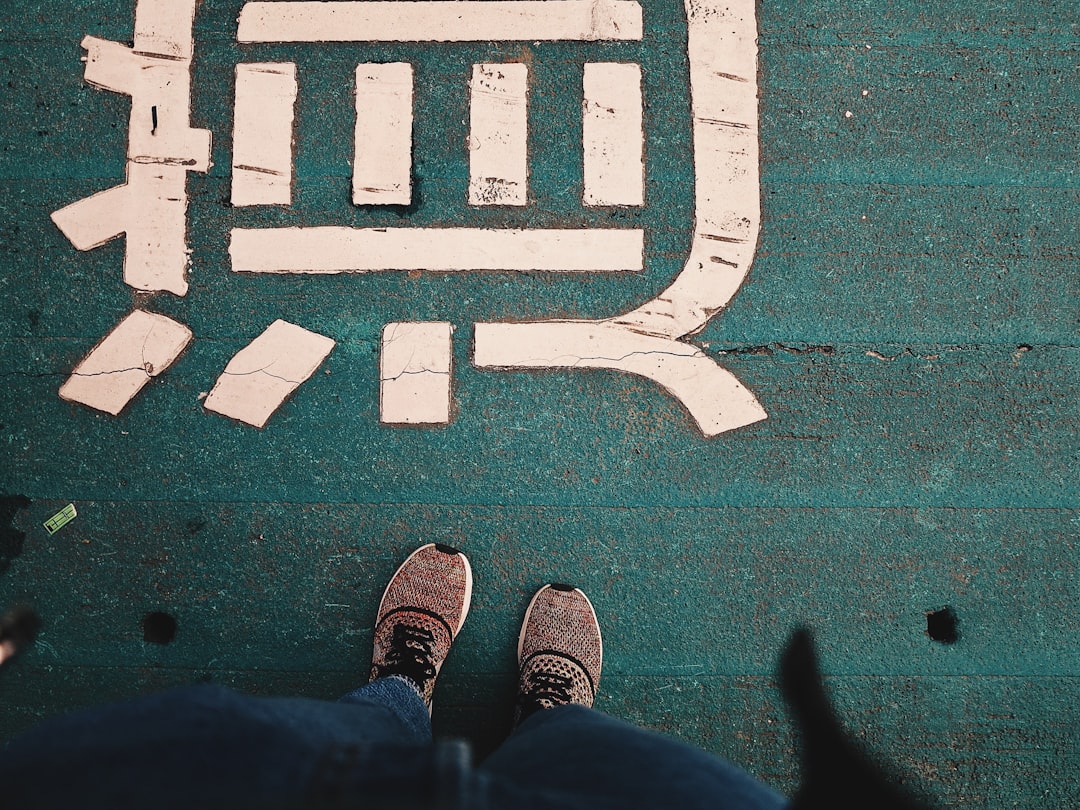 person standing on green floor,