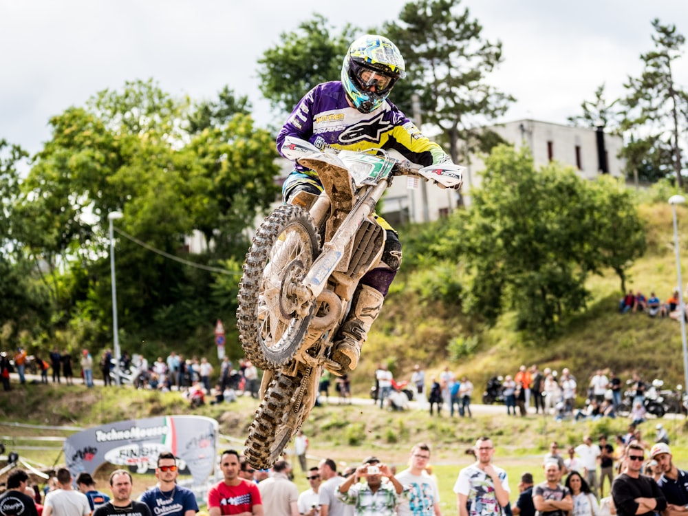 man riding motocross dirt bike