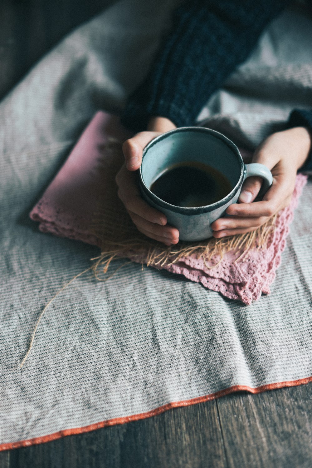 person holding green mug