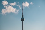 Exterior view of a telecommunications tower against a clear blue sky