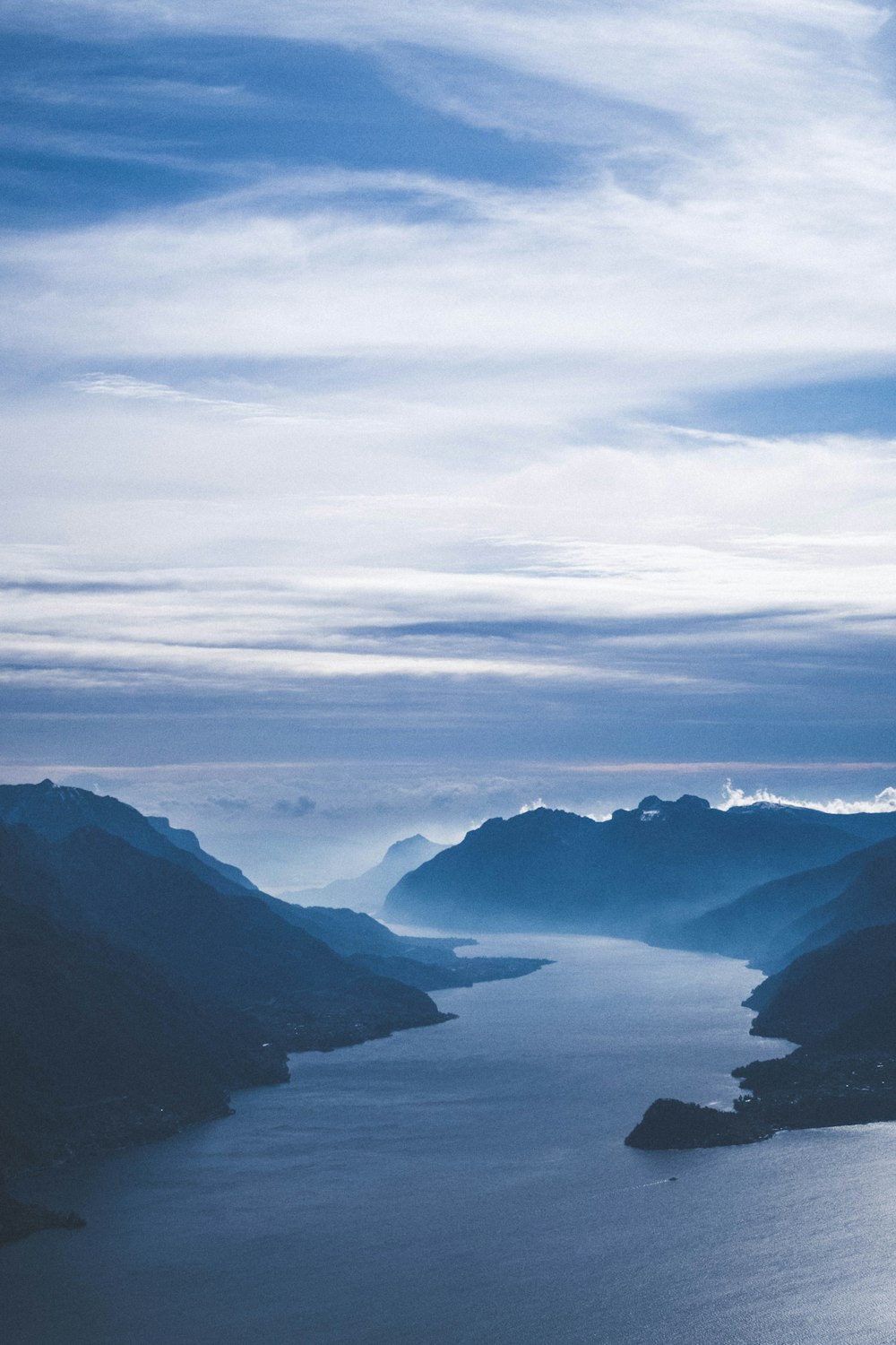 bird's eye view of body of water and mountains