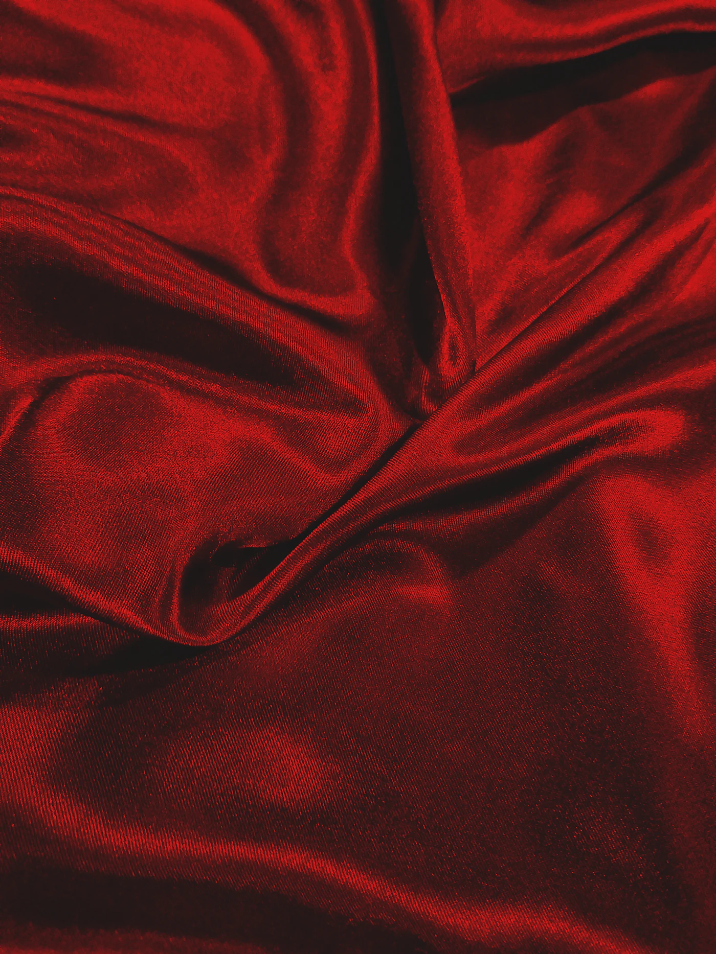Red silk, folded like something unsaid