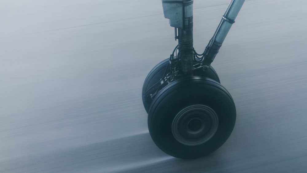 wheel on gray surface in closeup photography