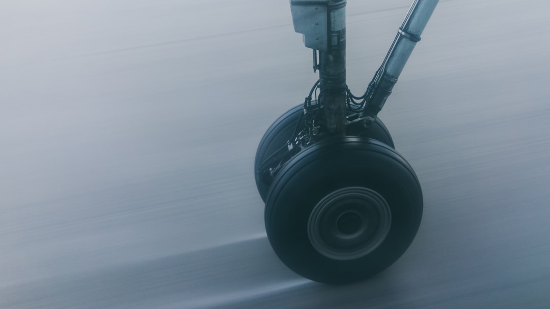 wheel on gray surface in closeup photography,