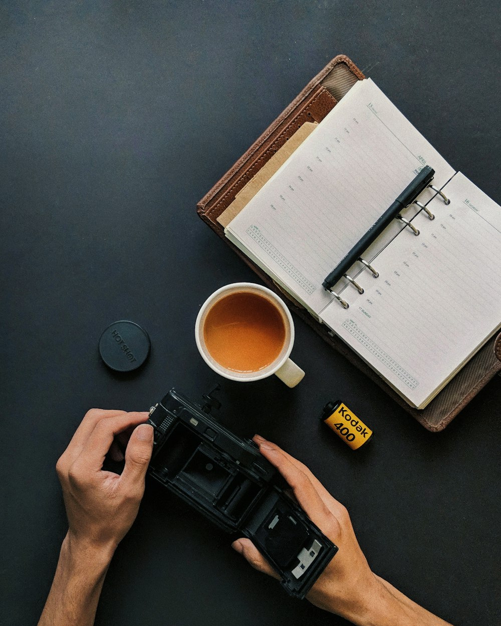 person holding Kodak camera