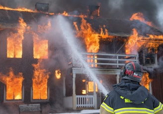 fireman watering fire