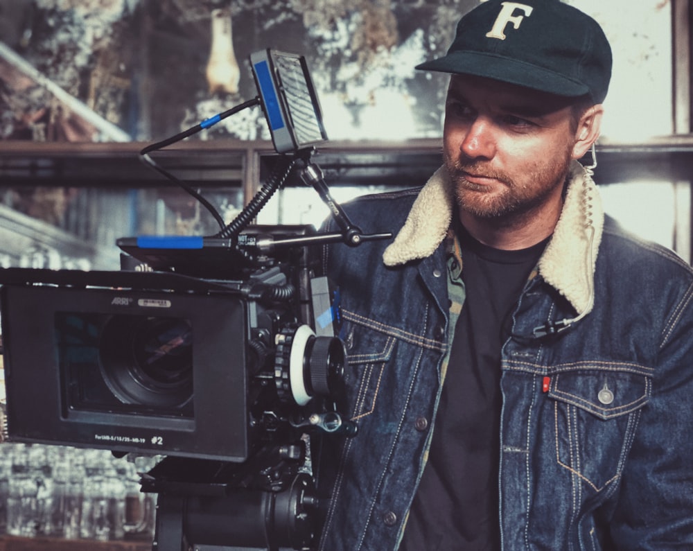 man taking video using studio camera