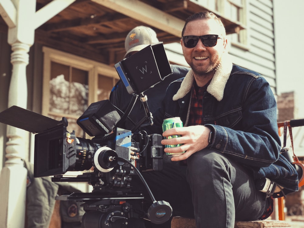 director holding green tin can