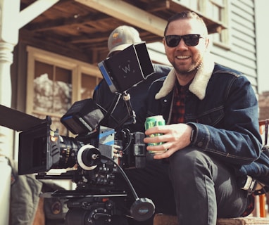 director holding green tin can